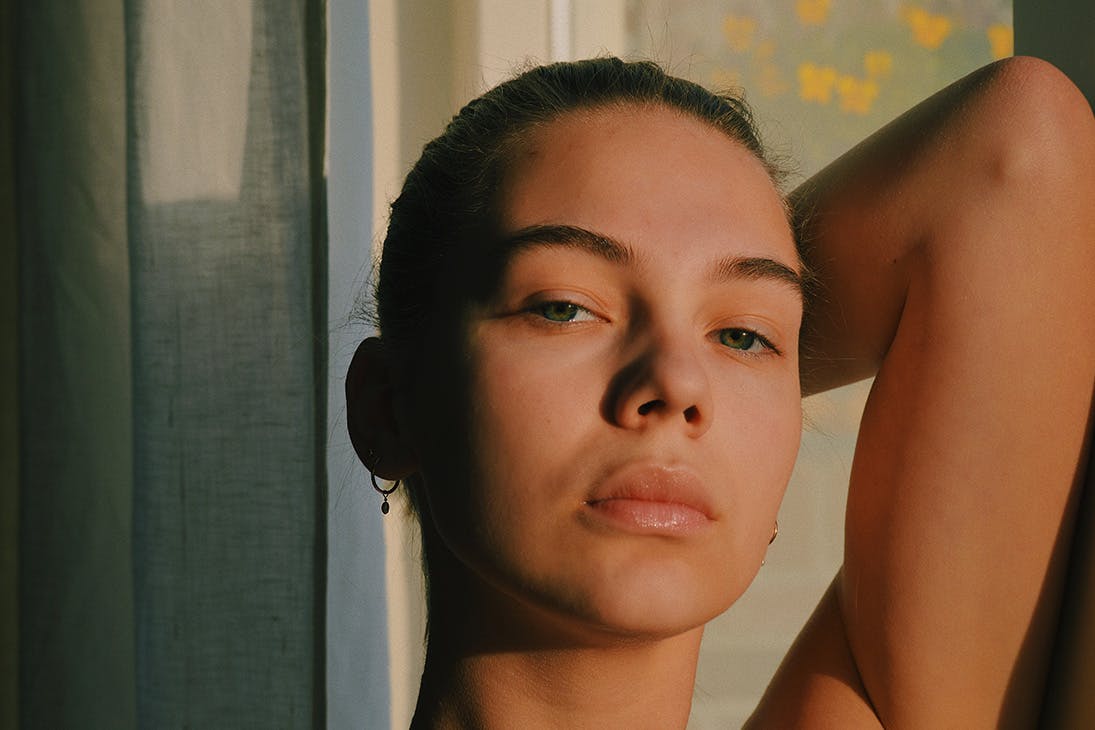 a close up image of a woman's bare face.